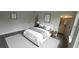Serene bedroom with neutral bedding, modern decor, and access to an en-suite bathroom at 16734 Sw 18Th Avenue Rd, Ocala, FL 34473