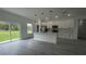 A modern kitchen featuring sleek countertops, stainless steel appliances, and an open floor plan at 16734 Sw 18Th Avenue Rd, Ocala, FL 34473
