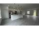 Modern kitchen featuring stainless steel appliances, white cabinets, and an island with pendant lighting at 16734 Sw 18Th Avenue Rd, Ocala, FL 34473