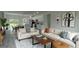 Bright living room features modern sofas, a wooden coffee table, and an open layout at 16734 Sw 18Th Avenue Rd, Ocala, FL 34473