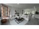 Stylish living room showcasing a neutral sectional sofa, modern decor, and an open layout at 16734 Sw 18Th Avenue Rd, Ocala, FL 34473
