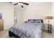 Neutral bedroom featuring a comfortable bed, contemporary side tables and ample lighting at 1855 Vista Royale Blvd, Orlando, FL 32835