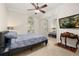 Cozy bedroom with ample natural light, mirrored closet doors, and a ceiling fan at 1855 Vista Royale Blvd, Orlando, FL 32835