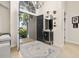 Bright foyer featuring high ceilings, decor, and a view to the well-manicured front yard at 1855 Vista Royale Blvd, Orlando, FL 32835