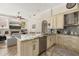 Modern kitchen featuring stainless appliances, granite countertops, and beautiful wood flooring at 1855 Vista Royale Blvd, Orlando, FL 32835