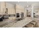 Open kitchen with granite countertops, stainless steel appliances, and a large island with bar seating at 1855 Vista Royale Blvd, Orlando, FL 32835