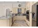 Modern kitchen boasting granite countertops and stainless steel appliances at 1855 Vista Royale Blvd, Orlando, FL 32835