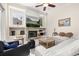 Cozy living room featuring a fireplace, TV, and comfortable seating at 1855 Vista Royale Blvd, Orlando, FL 32835
