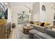 Comfortable living room featuring a large window and plush seating arrangements at 1855 Vista Royale Blvd, Orlando, FL 32835