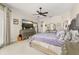 Spacious bedroom with a TV, large dresser and vanity at 1855 Vista Royale Blvd, Orlando, FL 32835
