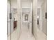 Generous walk-in closet with mirrored doors leading to the bathroom area at 1855 Vista Royale Blvd, Orlando, FL 32835