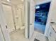 Clean bathroom with glass-enclosed shower, toilet, and a glimpse of themed bedroom beyond at 2034 Fleming Mist Pl, Kissimmee, FL 34747