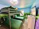 Playful ' bedroom features a bunk bed, mural, and built-in TV at 2034 Fleming Mist Pl, Kissimmee, FL 34747