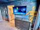 Fun themed bedroom with custom Star Wars wall murals and an adjacent bathroom at 2034 Fleming Mist Pl, Kissimmee, FL 34747