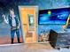Themed bedroom with a mounted TV and Star Wars wall murals, adjacent to the bathroom at 2034 Fleming Mist Pl, Kissimmee, FL 34747