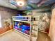 Whimsical ' bedroom with bunk beds and custom 'Star Wars' themed wall art at 2034 Fleming Mist Pl, Kissimmee, FL 34747