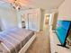 Bedroom with carpet and view of bathroom and hallway at 2034 Fleming Mist Pl, Kissimmee, FL 34747