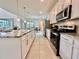 Open-concept kitchen with granite countertops, stainless steel appliances, and a spacious layout at 2034 Fleming Mist Pl, Kissimmee, FL 34747