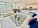 Bright living room features comfortable seating, stylish rug, and an open layout with great natural light at 2034 Fleming Mist Pl, Kissimmee, FL 34747