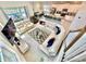 Wide angle view of the living space featuring open floor plan with kitchen, dining, and living areas at 2034 Fleming Mist Pl, Kissimmee, FL 34747