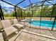 Enjoy this home's screened in pool and patio, with a spa, privacy fence and paver flooring at 2034 Fleming Mist Pl, Kissimmee, FL 34747