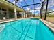 Sparkling screened-in pool with adjoining spa; perfect for relaxing and entertaining outdoors at 2034 Fleming Mist Pl, Kissimmee, FL 34747
