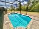 Private screened-in pool and spa offers a relaxing outdoor oasis at 2034 Fleming Mist Pl, Kissimmee, FL 34747