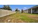 Spacious backyard with a play set and a wood fence surrounding the property at 2203 Bluebird Pl, St Cloud, FL 34771