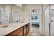 Bathroom boasts a double vanity with modern fixtures and a view into the bedroom at 2203 Bluebird Pl, St Cloud, FL 34771