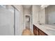Bathroom boasts a double vanity with modern fixtures, a separate toilet room, and a glass-enclosed shower at 2203 Bluebird Pl, St Cloud, FL 34771