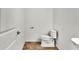 Clean and simple half-bathroom features a toilet and a sink, offering convenience for guests at 2203 Bluebird Pl, St Cloud, FL 34771