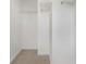 An empty walk-in closet with neutral carpet and wire shelving for storage at 2203 Bluebird Pl, St Cloud, FL 34771
