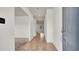 Hallway featuring tile flooring and ample lighting, with an entryway to other rooms at 2203 Bluebird Pl, St Cloud, FL 34771