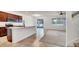 Open-concept kitchen flows into the living area, featuring a breakfast bar and stainless steel appliances at 2203 Bluebird Pl, St Cloud, FL 34771