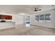 Open-concept living room featuring tile flooring and a sliding glass door for easy outdoor access at 2203 Bluebird Pl, St Cloud, FL 34771