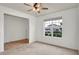 Bright room with carpet, ceiling fan, and window offering a street view at 2203 Bluebird Pl, St Cloud, FL 34771