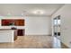 Bright living room featuring tile floors, modern lighting, and sliding glass doors to the outdoor space at 2203 Bluebird Pl, St Cloud, FL 34771