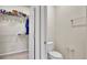 Toilet room features a toilet and access to a walk-in closet with shelving for optimal storage at 2203 Bluebird Pl, St Cloud, FL 34771