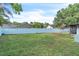 Large backyard with a white privacy fence and a well-maintained lawn at 227 Morning Glory Dr, Lake Mary, FL 32746