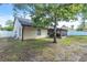 Home's backyard features a partially shady area with a screened in porch at 227 Morning Glory Dr, Lake Mary, FL 32746