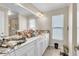 Spacious bathroom featuring a large mirror, ample counter space, and bright lighting, perfect for getting ready at 227 Morning Glory Dr, Lake Mary, FL 32746