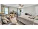 Spacious bedroom featuring a ceiling fan and two windows for natural light at 227 Morning Glory Dr, Lake Mary, FL 32746