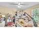 Bedroom or flex space with white shelving, a ceiling fan, and natural light, great for hobbies and storage at 227 Morning Glory Dr, Lake Mary, FL 32746