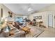 Bright living room with vaulted ceiling, fireplace, and sliding door to patio at 227 Morning Glory Dr, Lake Mary, FL 32746
