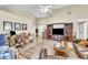 Spacious living room with vaulted ceiling, neutral walls, and media center at 227 Morning Glory Dr, Lake Mary, FL 32746