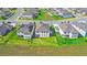 An aerial view highlights a home's solar panels, backyard, and neighborhood's landscape at 2294 Gold Dust Dr, Minneola, FL 34715