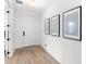 Bright entryway featuring wood floors, white walls, and decorative art at 2294 Gold Dust Dr, Minneola, FL 34715
