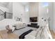 Expansive living area with a modern fireplace, sleek decor, and an abundance of natural light at 2294 Gold Dust Dr, Minneola, FL 34715