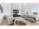 Comfortable living room with soaring ceilings, a fireplace, and modern decor at 2294 Gold Dust Dr, Minneola, FL 34715