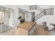 Bright living room with an open floor plan leading to the kitchen and backyard access at 2294 Gold Dust Dr, Minneola, FL 34715